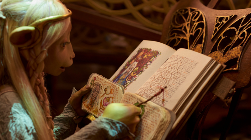 Brea (Anya Taylor-Joy) examines a symbol in her books.